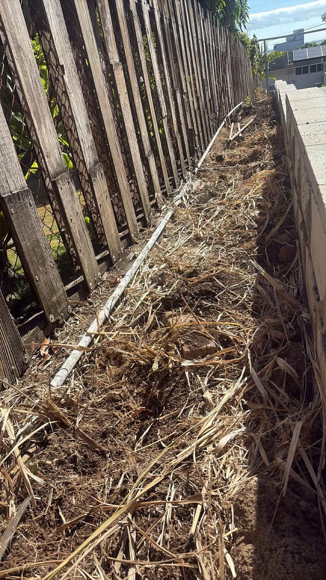 Retaining wall section along property fence line, Honolulu residence