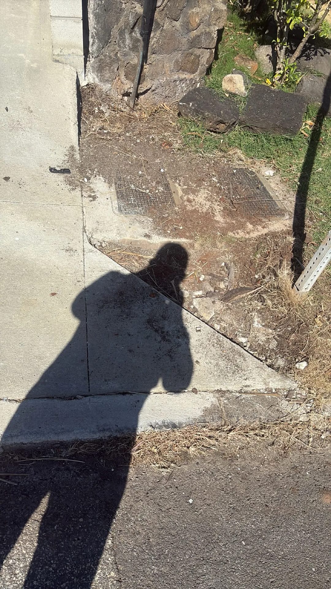 Warrior Construction crew inspecting retaining wall repair, Honolulu residence