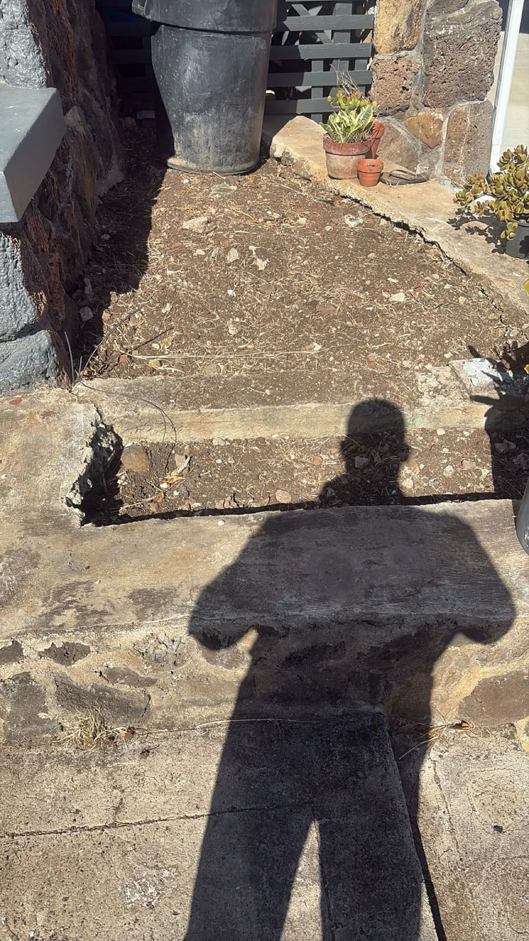 Crew inspecting new retaining wall section, Honolulu residence