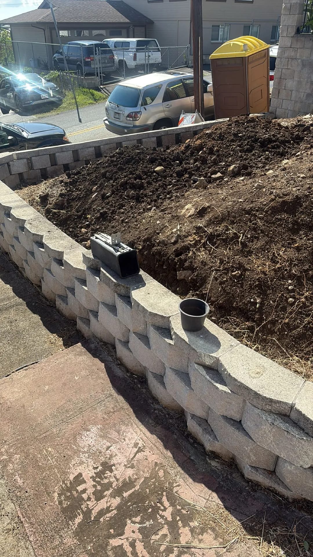 New segmental block retaining wall section with soil backfill, Honolulu residence