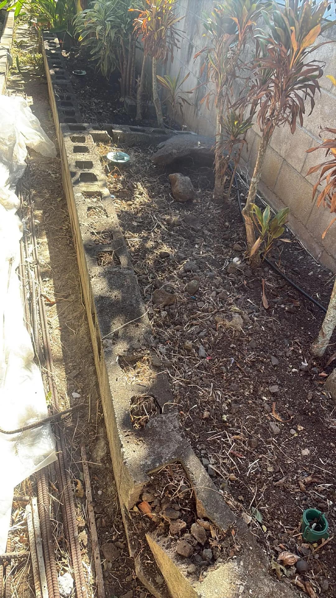Retaining wall trench area during repair, Honolulu residence